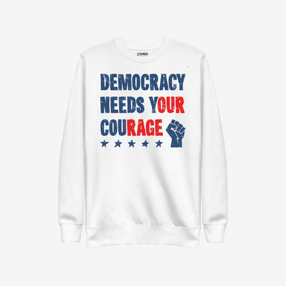 Democracy Hoodie & Sweatshirt features a powerful distressed print: “DEMOCRACY NEEDS YOUR COURAGE” with a raised fist and stars, embodying protest spirit and resilience for the defiant.