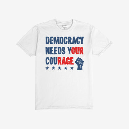 Democracy T-shirt featuring a bold slogan “DEMOCRACY NEEDS YOUR COURAGE” with a distressed, retro-style design, accented by stars and a raised fist graphic, embodying a message of resistance.