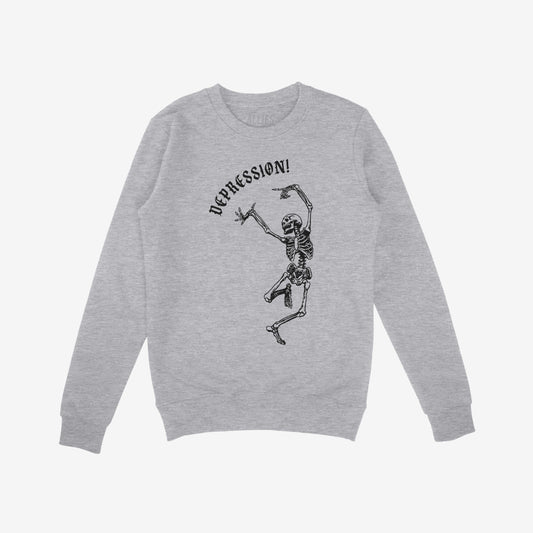 Light-heather gray Depression Sweatshirt featuring a black graphic of a dancing skeleton with “DEPRESSION!” in Gothic font above, embodying dark humor and raw honesty.