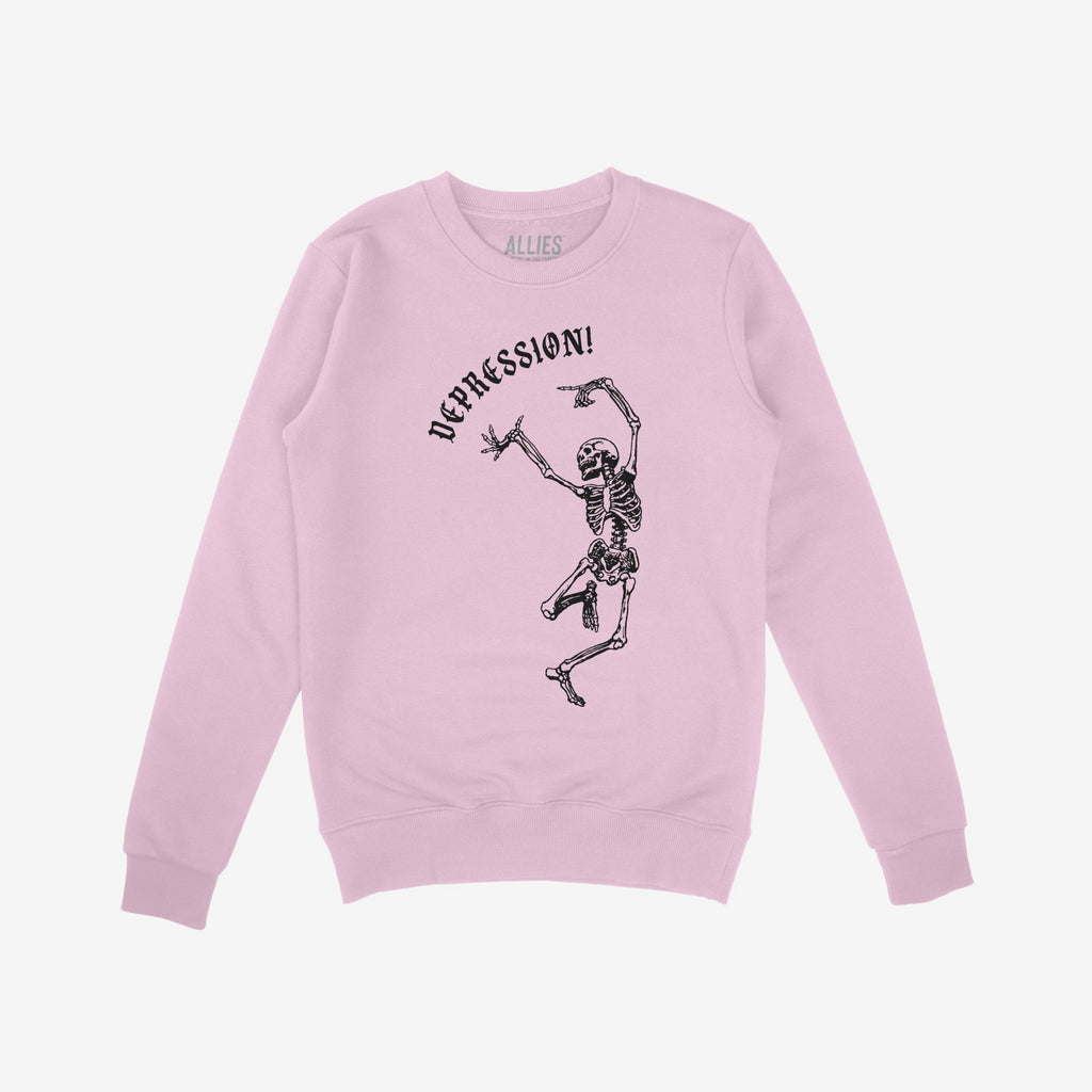 Light-pink crewneck sweatshirt featuring a black line-drawing of a dancing skeleton with DEPRESSION! above it in gothic font, reflecting dark humor and existential themes.