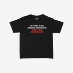 Don't Be Complicit Baby Tee features a bold slogan in white and red, emphasizing action against injustice. This black, retro-style women’s t-shirt blends activism with a versatile, fitted or baggy look.