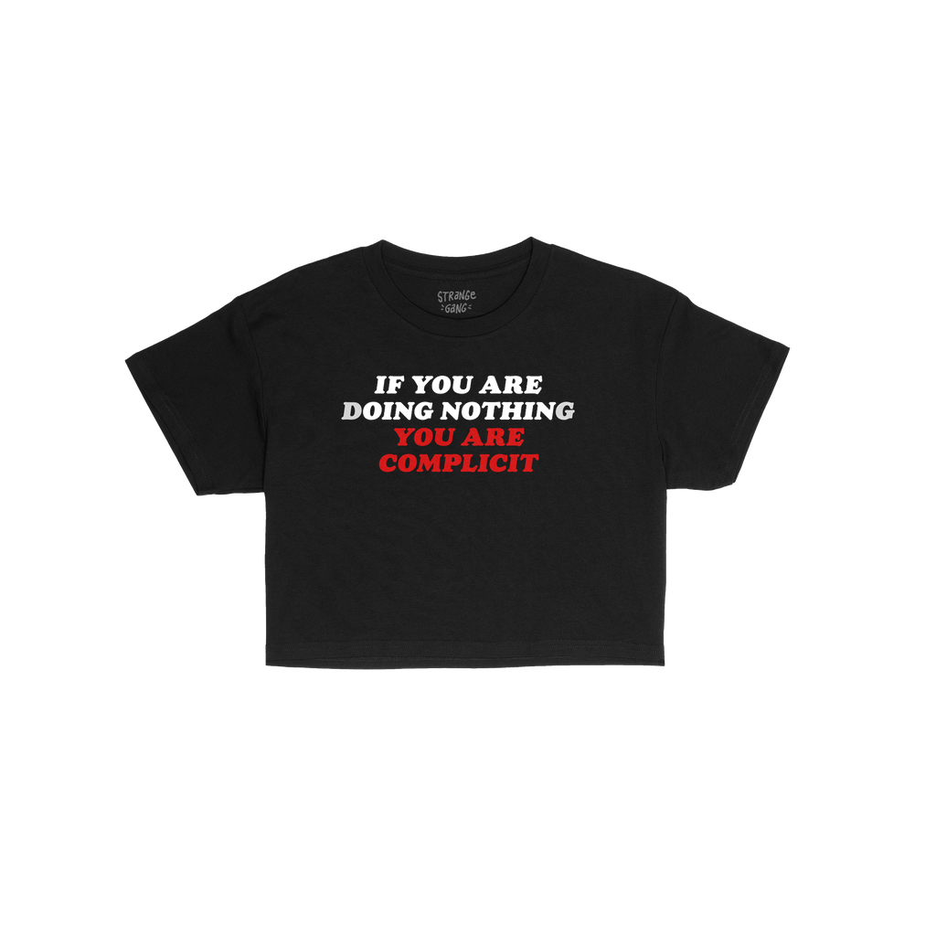 Don't Be Complicit Baby Tee features a bold slogan in white and red, emphasizing action against injustice. This black, retro-