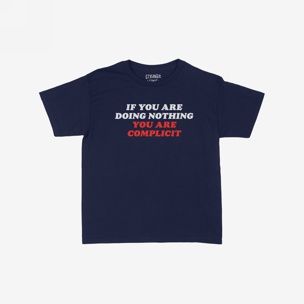 Navy-blue Don't Be Complicit Baby Tee featuring a bold slogan in white and red, embodying a protest message. The tee offers a retro cut for versatile styling options.