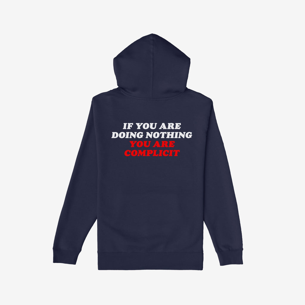 Navy-blue Don't Be Complicit Hoodie featuring a bold slogan on the back. The message, emphasizing action against complicity, is printed in white and red block letters, suitable for activism and everyday wear.