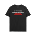 Don't Be Complicit T-shirt features bold white and red slogan urging action against injustice. This black tee embodies protes
