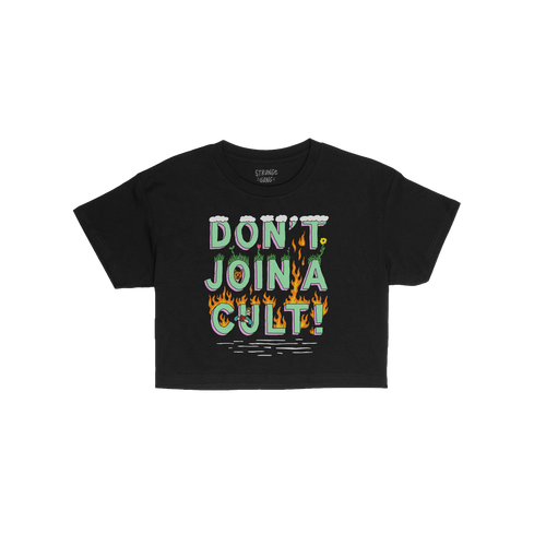 Don't Join A Cult Women's Baby Tee features bold, 3D-style lettering with grass, flowers, clouds above, and flames below, off