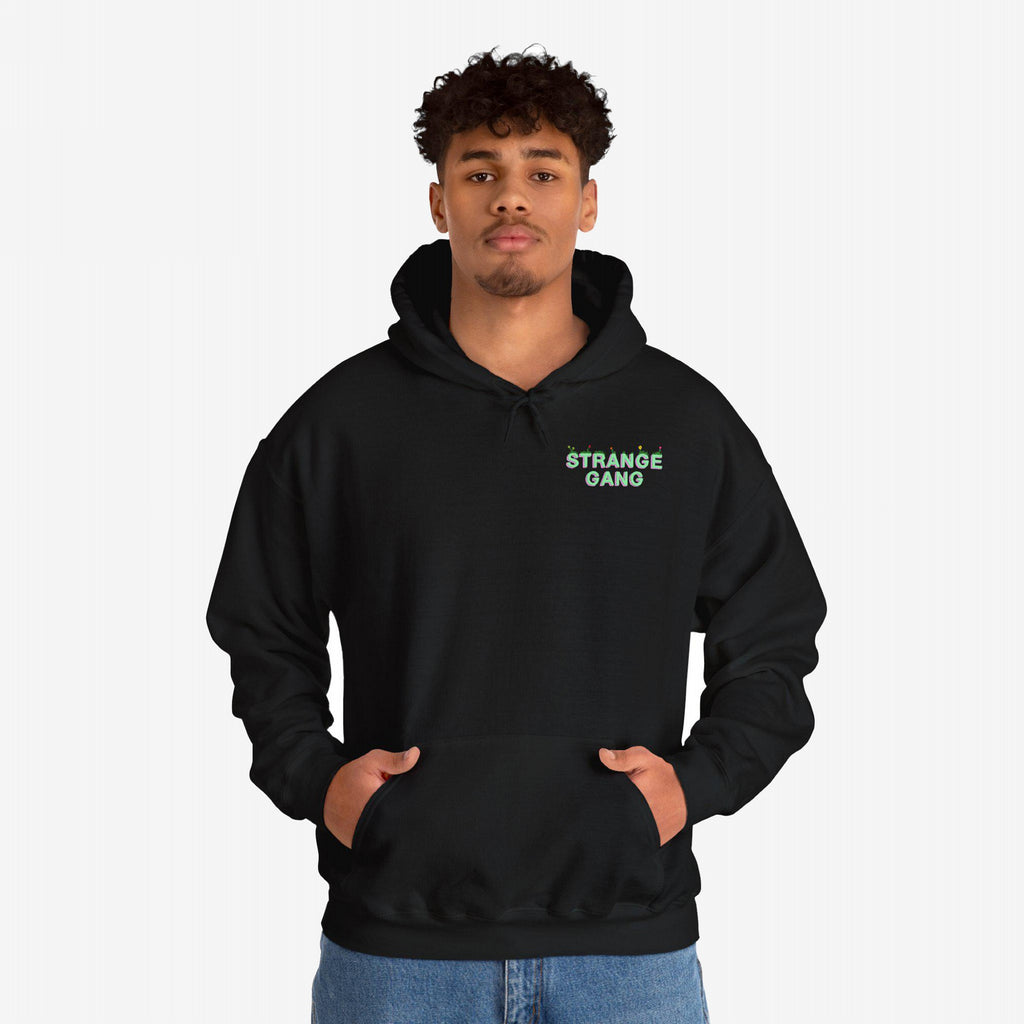 Young man models the Don't Join A Cult hoodie, featuring a kangaroo pocket and subtle green logo, embodying a progressive anti-establishment message with style and purpose.