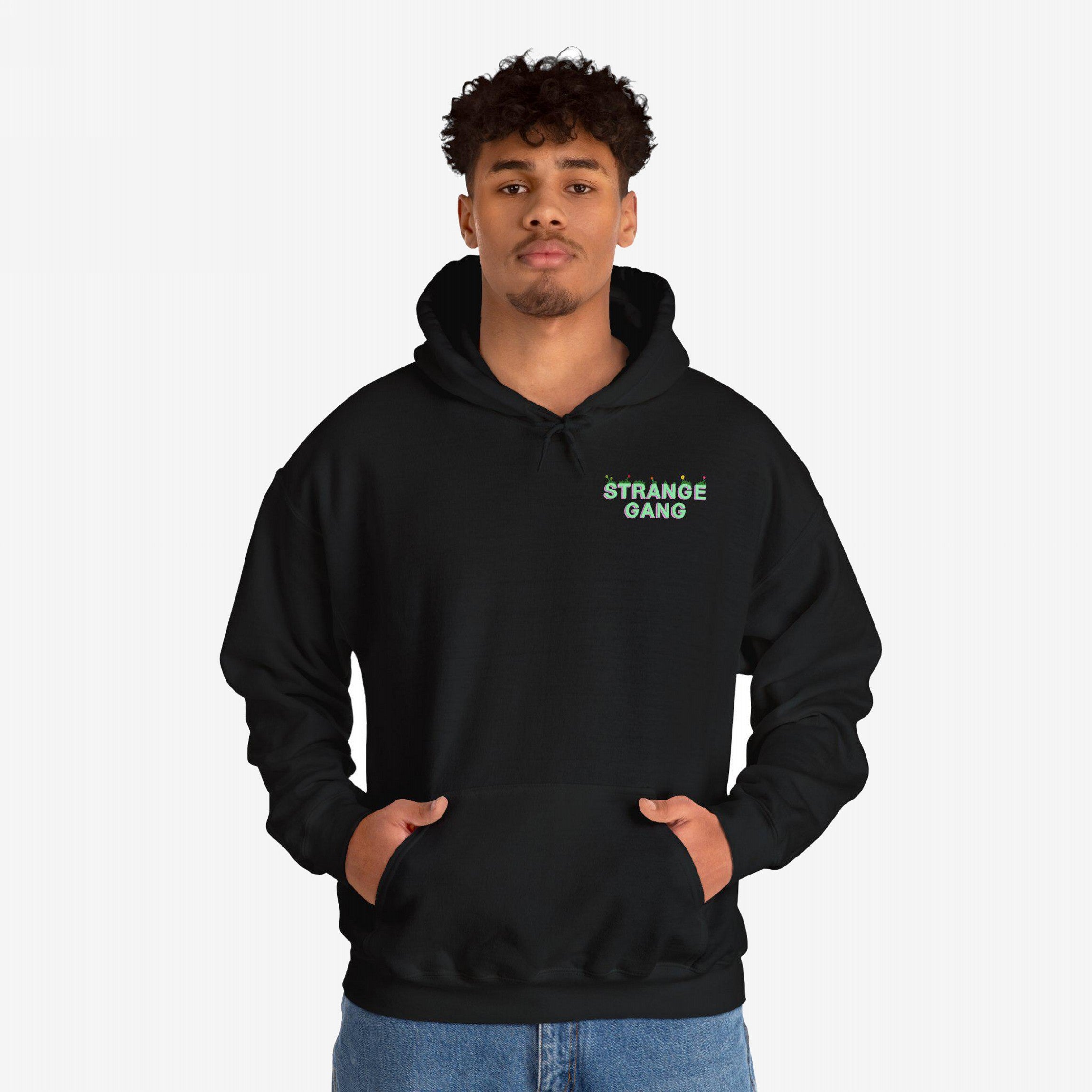 Young man models the Don't Join A Cult hoodie, featuring a kangaroo pocket and subtle green logo, embodying a progressive anti-establishment message with style and purpose.