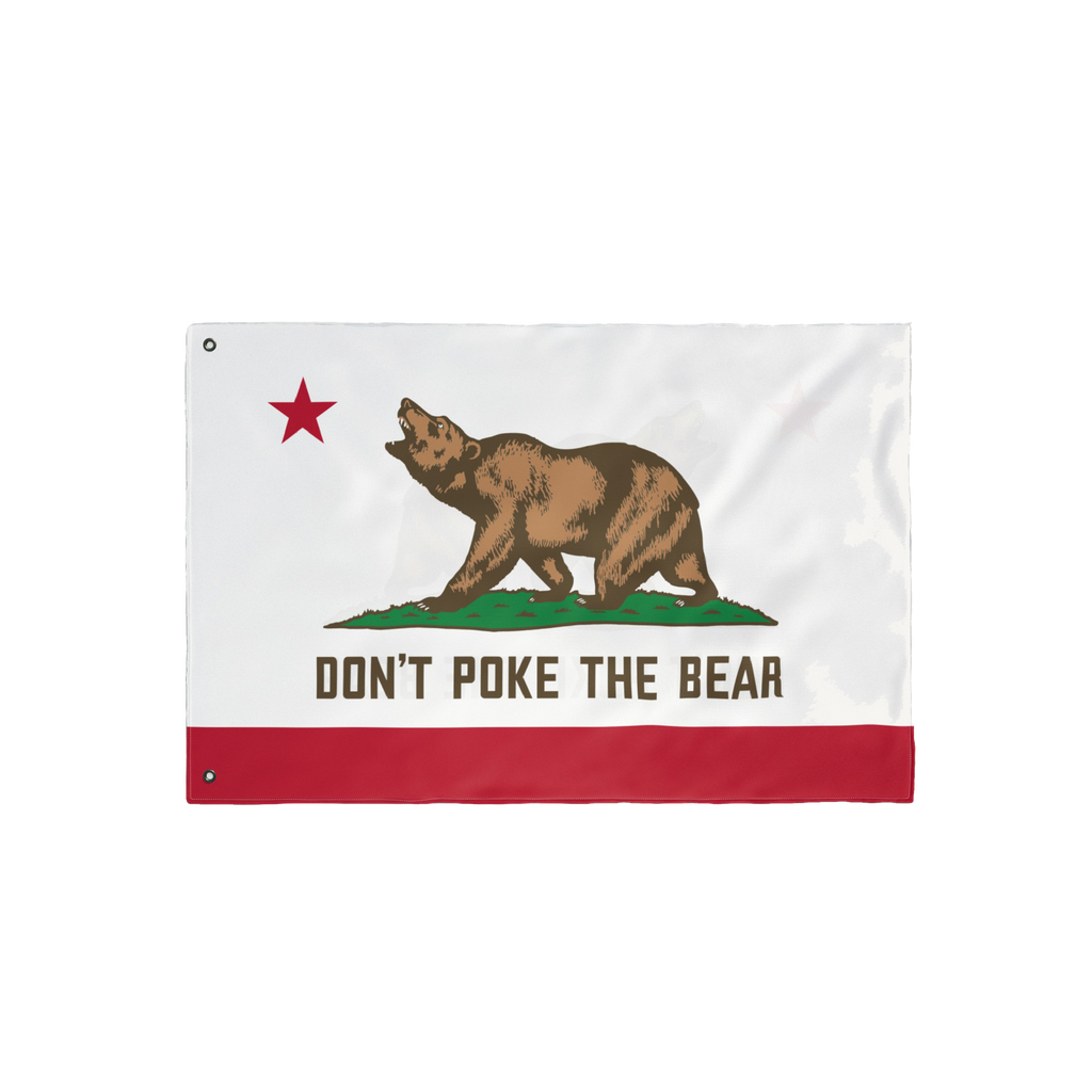California Don't Poke The Bear Flag features a grizzly on green grass with a red star, bold text, and stripe, symbolizing def