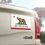 Zoomed-in view of California protest magnet with bear design on truck, detailed anti-authoritarian graphic
