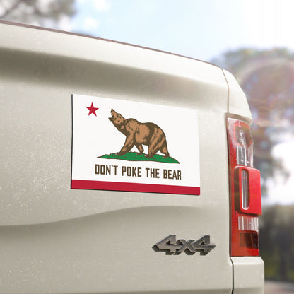 Zoomed-in view of California protest magnet with bear design on truck, detailed anti-authoritarian graphic