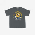Downhill Women's Baby Tee featuring a retro-style graphic of a cheerful cartoon smiley-face with IT’S ALL DOWNHILL FROM HERE text, delivering a playful take on existential themes.