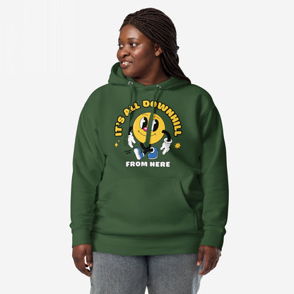 Dark-skinned woman models the Downhill Hoodie & Sweatshirt, featuring a cartoon yellow smiley and the slogan It’s all downhill from here, embodying a humorous, realist perspective in cozy fleece.