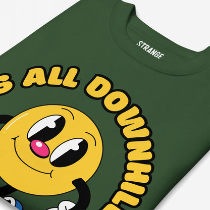 Downhill Hoodie & Sweatshirt featuring a cartoonish yellow smiley with floppy arms and bubble-text IS ALL DOWNHILL, embodying a playful yet realistic take on life's chaos.