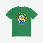Downhill Shirt: A green T-shirt featuring a retro-cartoon, yellow smiley-face character with gloves and sneakers. Bold text above and below reads IT’S ALL DOWNHILL FROM HERE, offering playful, vintage-inspired sarcasm.