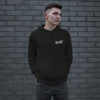 Young man in a black Dreams hoodie with ALLIES logo, embodying ambition and resilience. The hoodie features a front pouch pocket, reflecting defiance and determination. Perfect for those courageously chasing dreams.