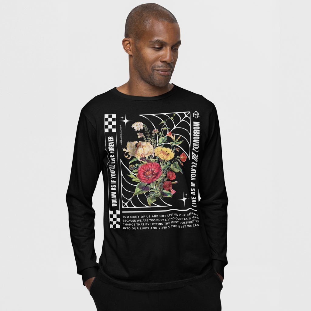 Dreams T-shirt featuring vibrant floral graphics and inspirational quotes, worn by a Black man. The design embodies a message of hope and urgency, reflecting values of equality and self-expression.