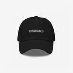 Black Drugs Hat with “DRUGS ;)” embroidered on the front, making a bold, ironic statement. A stylish accessory that adds edge and sparks conversation, aligning with the store's advocacy for equality and individuality.