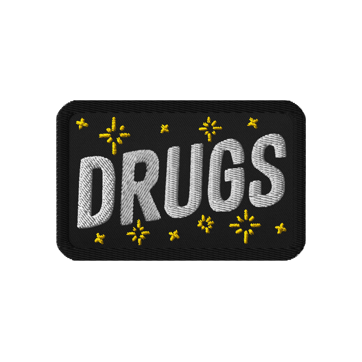 Drugs Patch featuring DRUGS in bold white stitching, adorned with small yellow star-like accents on black fabric. Perfect for