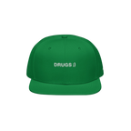 Bright green snapback cap with flat brim, featuring bold white embroidery reading “DRUGS ;)” on front. Eyelets enhance br