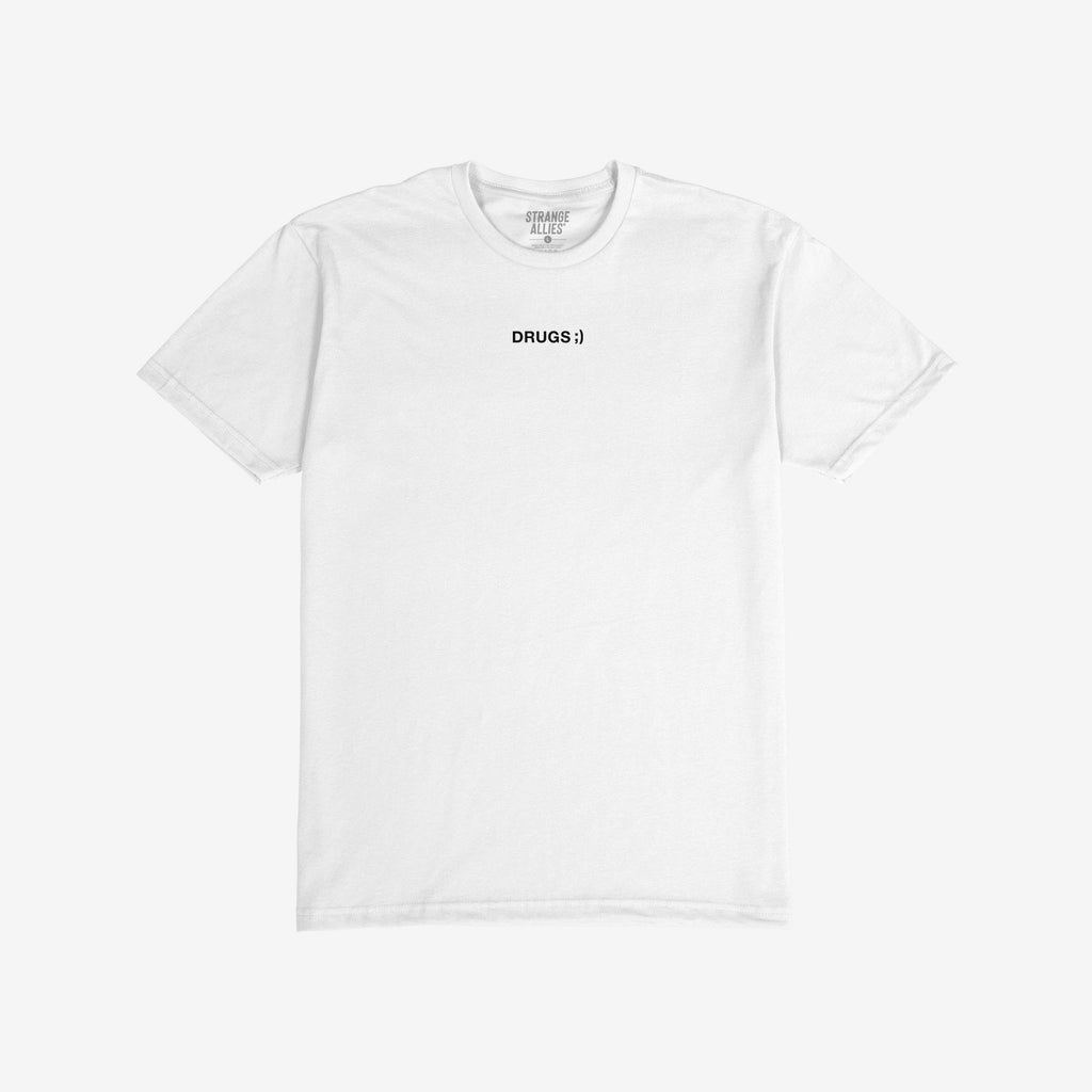 Drugs T-shirt featuring a minimalist design with DRUGS ;) in black on a plain white tee. The collar label reads STRANGE ALLIES., embodying a bold, unapologetic statement.