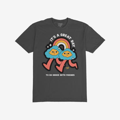 Drugs With Friends T-shirt features playful clouds under a rainbow with bold text, celebrating nonconformity and connection. Ideal for those embracing community and psychedelic vibes with humor.