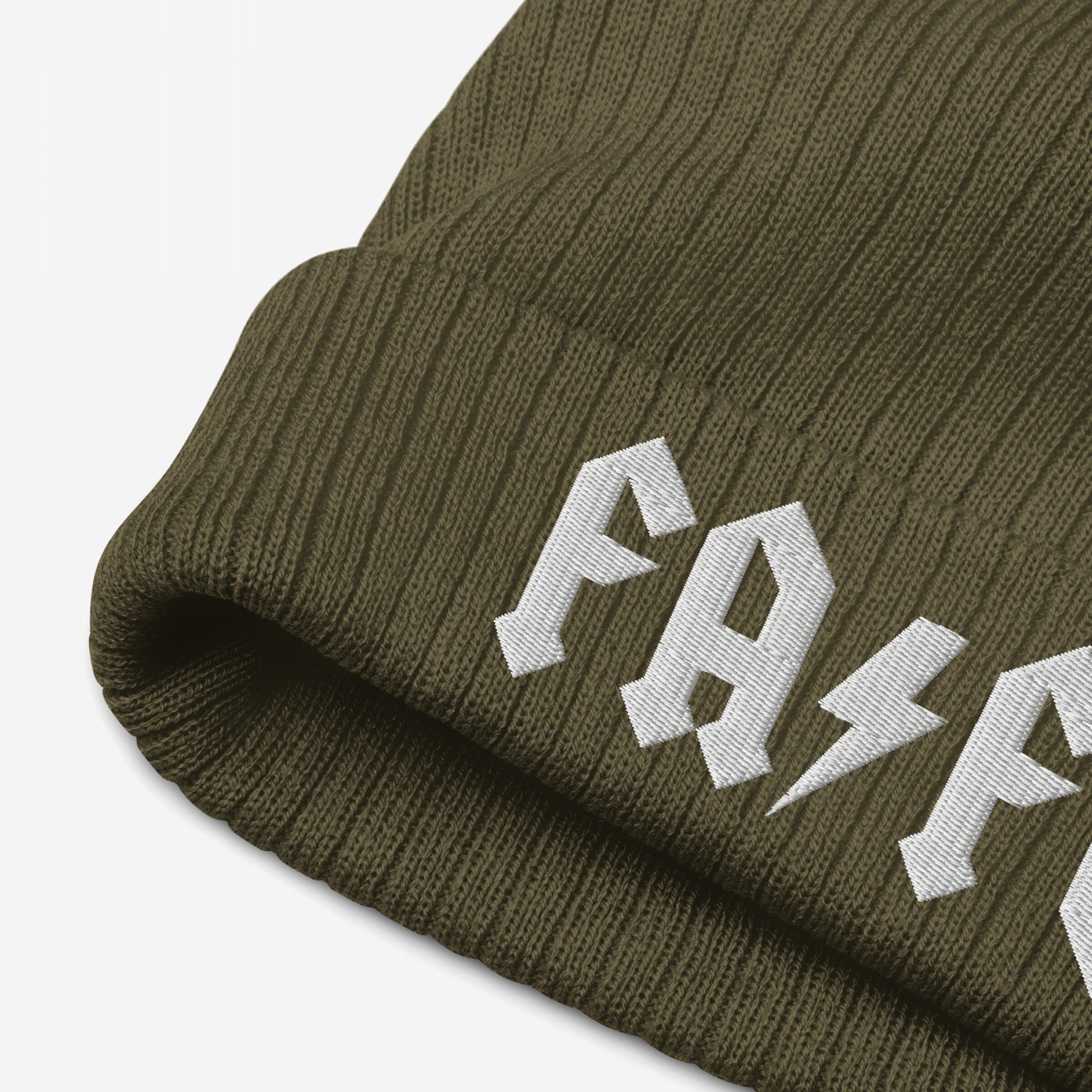 Close-up of the FAFO Hat, an olive-green ribbed knit beanie featuring a fold-over cuff with white embroidered lettering and a lightning-bolt motif, embodying a bold, hard rock-inspired style.