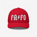 Red trucker-style FAFO Hat with bold, white FA ⚡ FO embroidery, embodies a hard rock-inspired resistance against fascism and extremism, perfect for those making a statement in challenging climates.