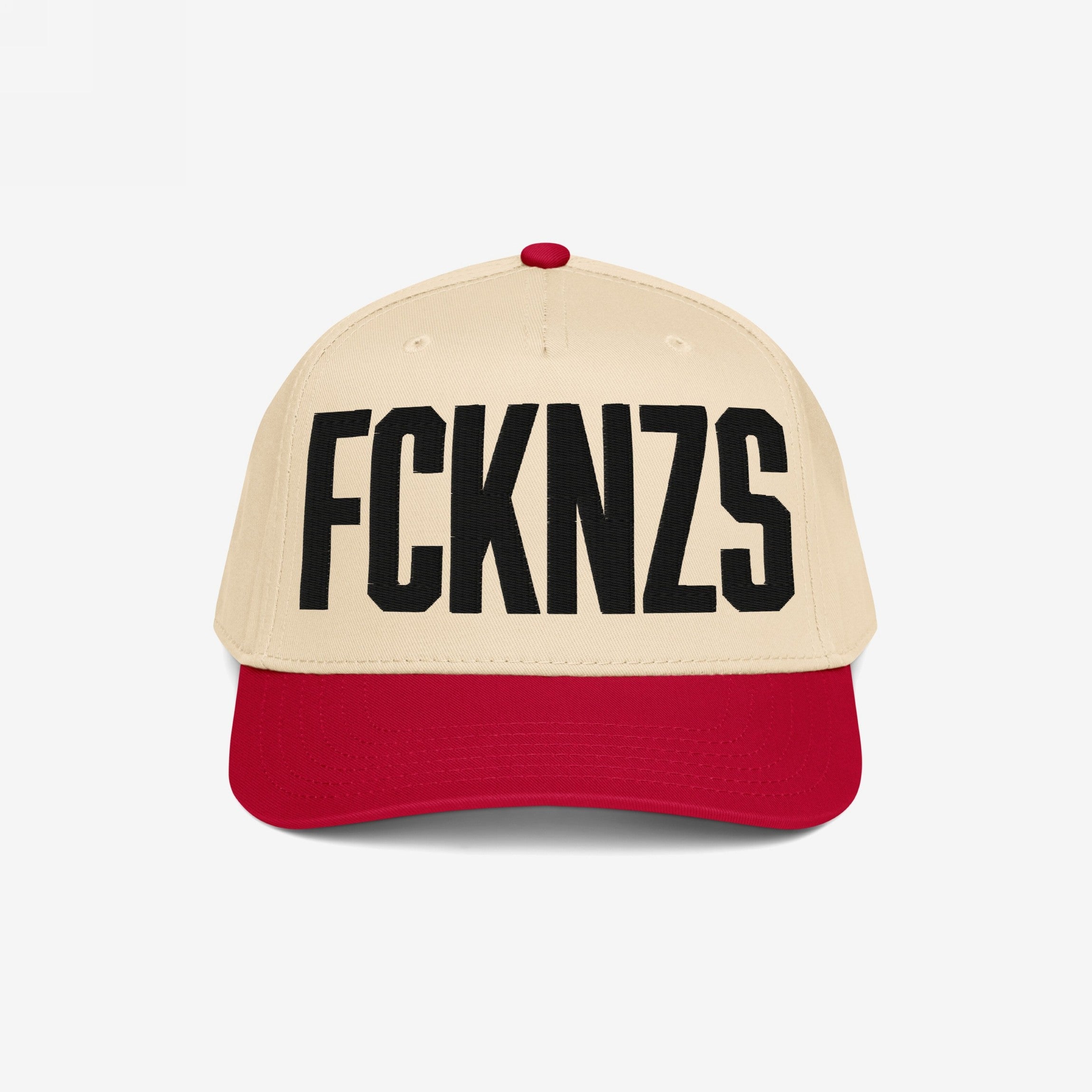 FCKNZS Hat featuring a light beige crown and red bill with bold black FCKNZS embroidery, embodying a strong anti-fascist message for visible protest and everyday wear.