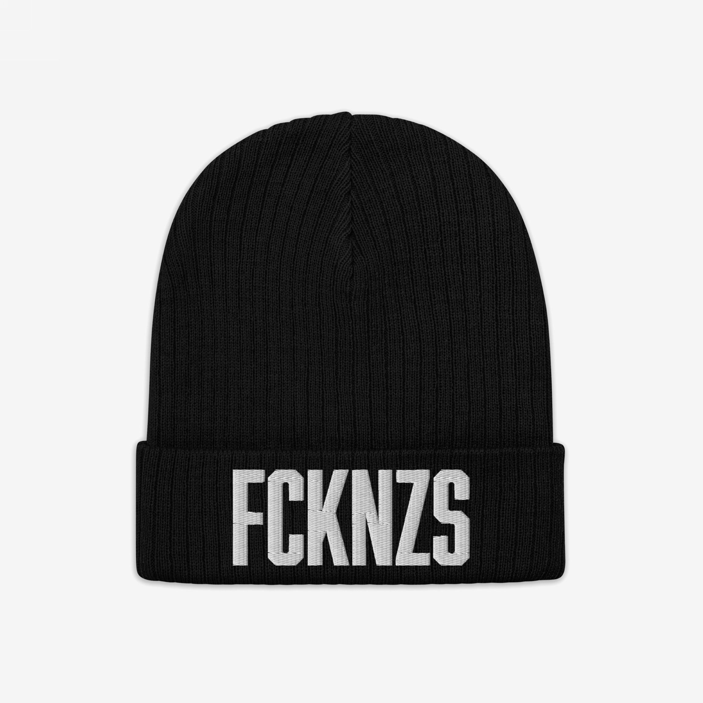 Black FCKNZS Hat, a knitted beanie featuring bold white embroidery, symbolizes anti-fascist protest. Ideal for expressing strong stances in everyday settings.