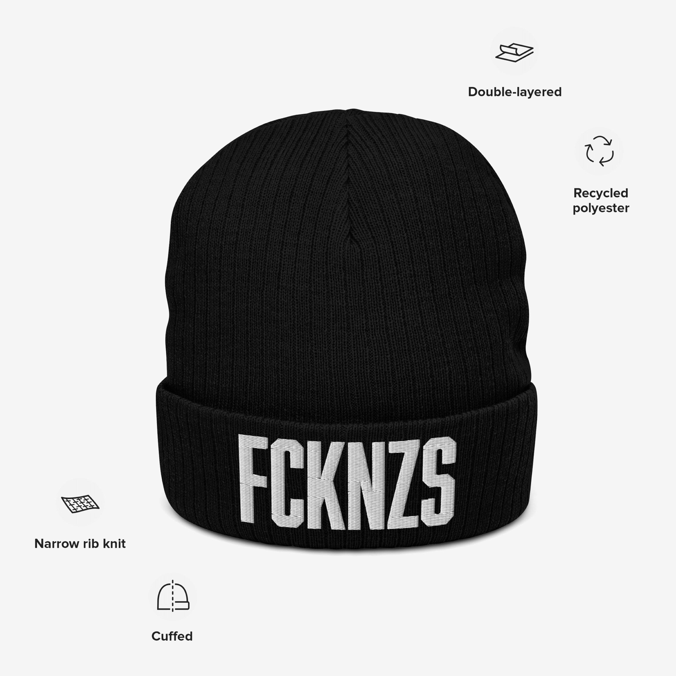FCKNZS Hat: A black cuffed knit beanie with bold white FCKNZS embroidery. Features include double-layered recycled polyester, narrow rib knit, and a protest design against fascism, promoting equality.