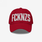 Red FCKNZS Hat with FCKNZS embroidered in white on the front, symbolizing anti-fascist protest. Ideal for those wanting a visible stance against hate, crafted for everyday activism.