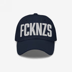 Navy blue FCKNZS Hat with curved brim, featuring bold white block letters for an anti-fascist statement. Ideal for expressing clear boundaries in everyday life or activism.