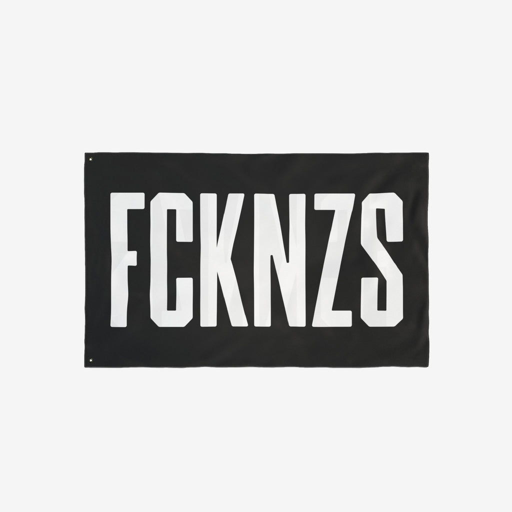 Black FCKNZS flag with bold white letters, symbolizing anti-fascism. Ideal for home display or protests, this double-sided flag comes in four sizes to make a powerful statement against hate.