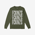 Olive-green FCKNZS T-shirt with distressed white block letters stacked vertically, embodying an anti-fascist message. Long-sleeve design laid flat, showcasing bold protest statement against hate.