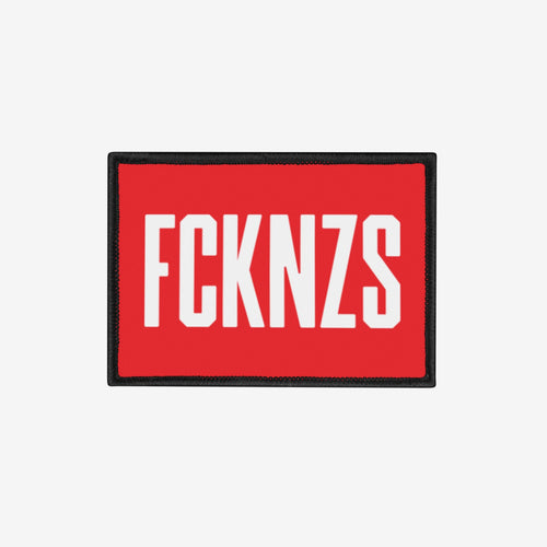 FCKNZS Patch: A bold protest cloth patch with white block letters on a red background, featuring a black border. Ideal for jackets or bags, it conveys an anti-fascist message with clarity.