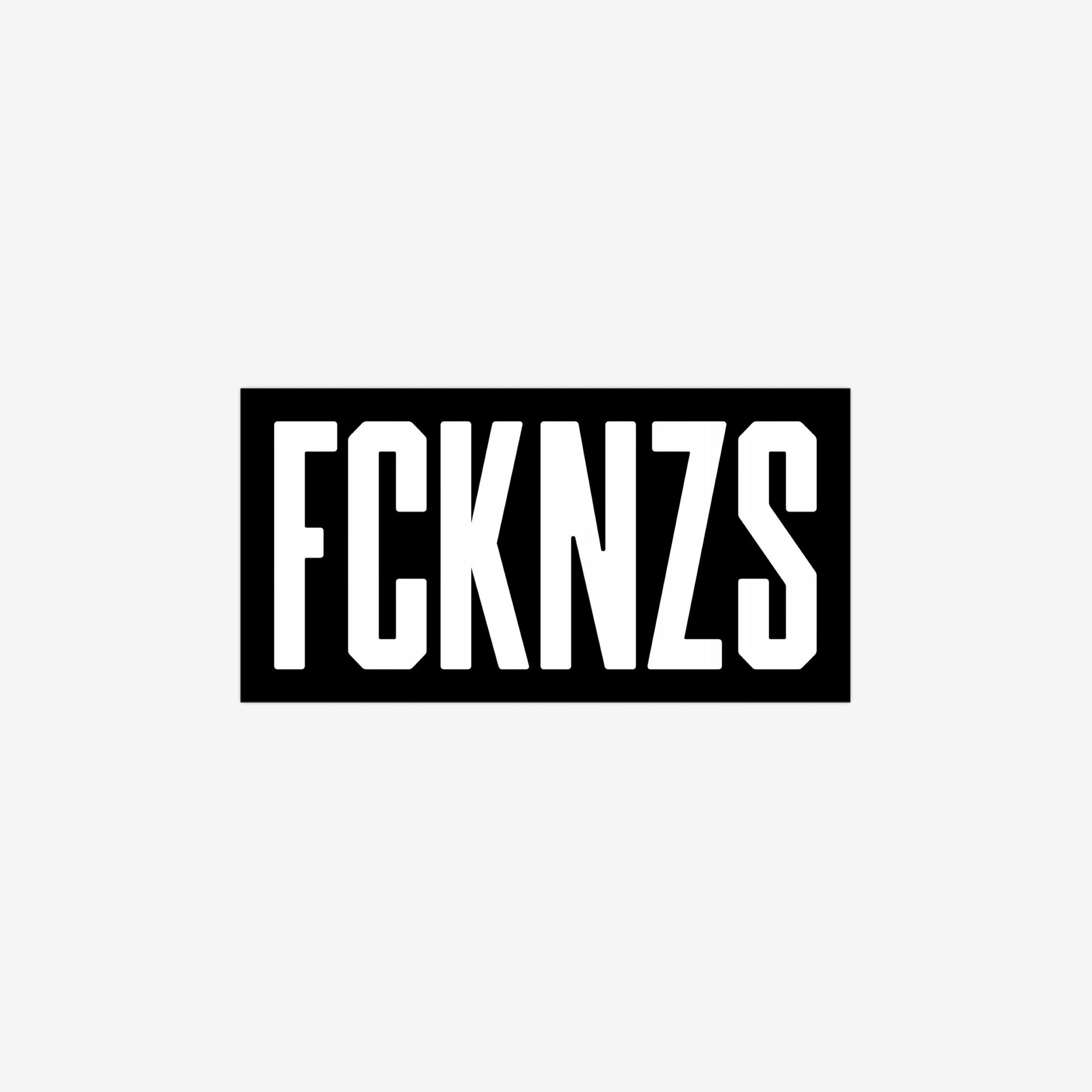 FCKNZS Sticker & Magnet featuring bold stencil-style FCKNZS text in white on black, symbolizes anti-fascist protest. Available as 7.5 x 3.75 sticker or 7.5 x 4.5 magnet.
