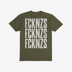 Olive-green FCKNZS T-shirt (back view) displaying bold, distressed white text FCKNZS repeated thrice, embodying an anti-fascist protest message with a direct stance against hate and oppression.