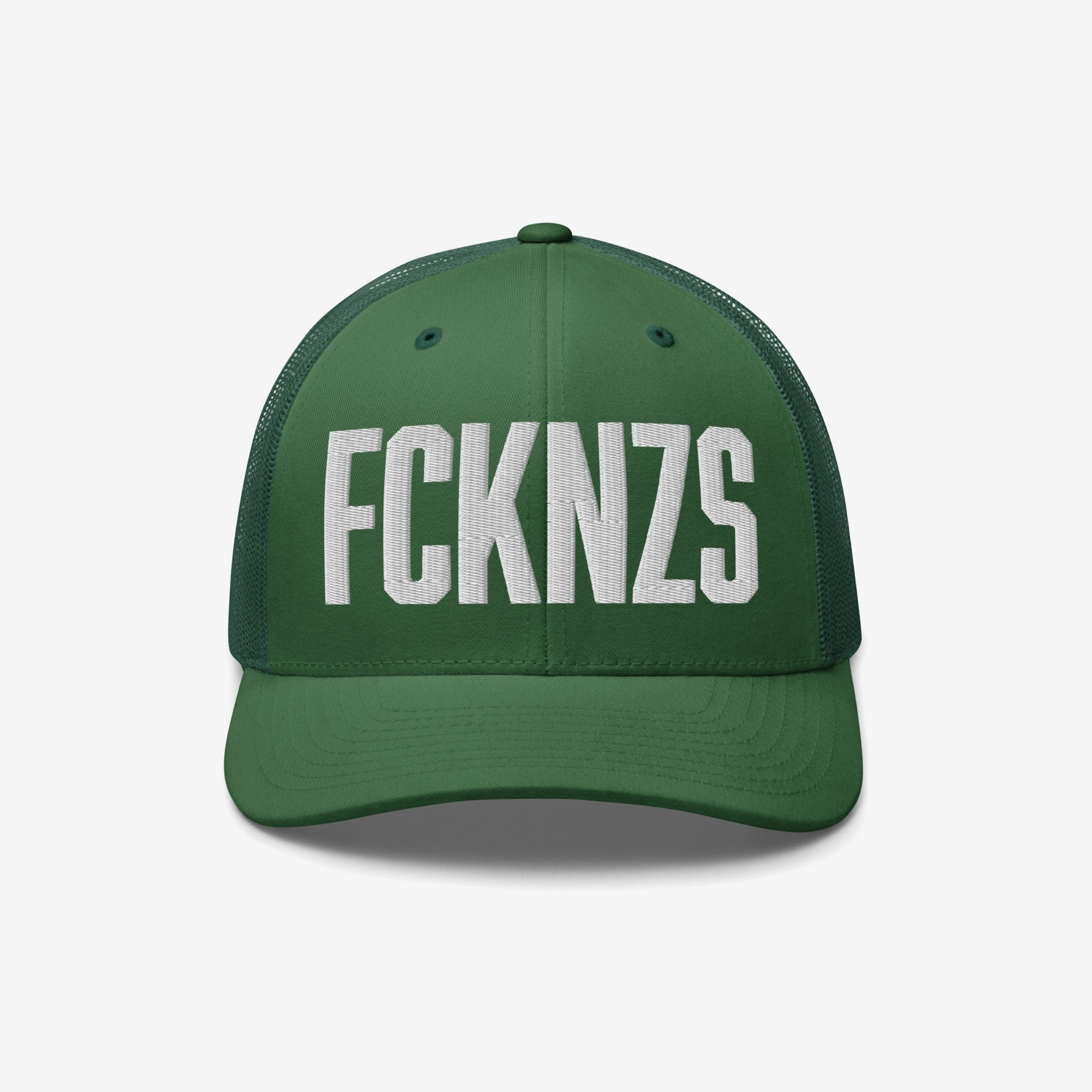 Dark-green FCKNZS Hat featuring white block-letter embroidery, curved brim, and mesh back panels. This trucker cap embodies an anti-fascist message, perfect for marches and everyday expression against hate.