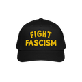 Fight Fascism Hat featuring bold yellow FIGHT FASCISM embroidery on a black baseball cap, designed for anti-fascist advocacy 
