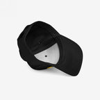 Fight Fascism Hat: Plain black baseball cap with curved brim, visible inner lining, and adjustable back strap, emphasizing an anti-fascist message with bold yellow FIGHT FASCISM embroidery for visibility and activism.