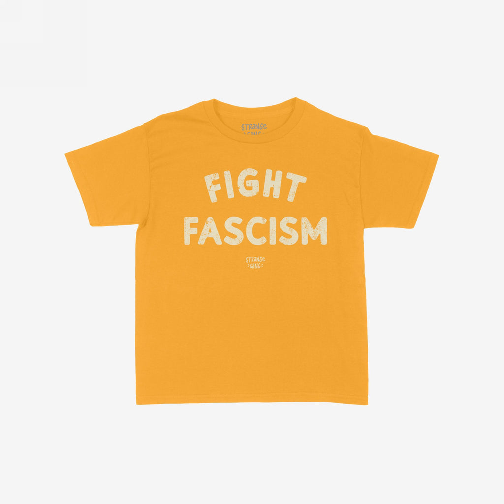 Fight Fascism Women's Baby Tee in mustard, featuring large distressed white text FIGHT FASCISM and smaller brand lettering. Designed as a retro Y2K style for activism, protests, and equality support.