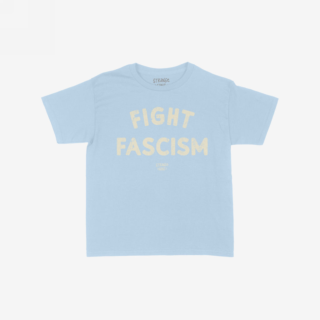 Light-blue Fight Fascism Women's Baby Tee featuring the slogan “FIGHT FASCISM” in distressed, off-white letters with a small brand logo beneath. Ideal for anti-fascists, equality supporters, or protest-goers.