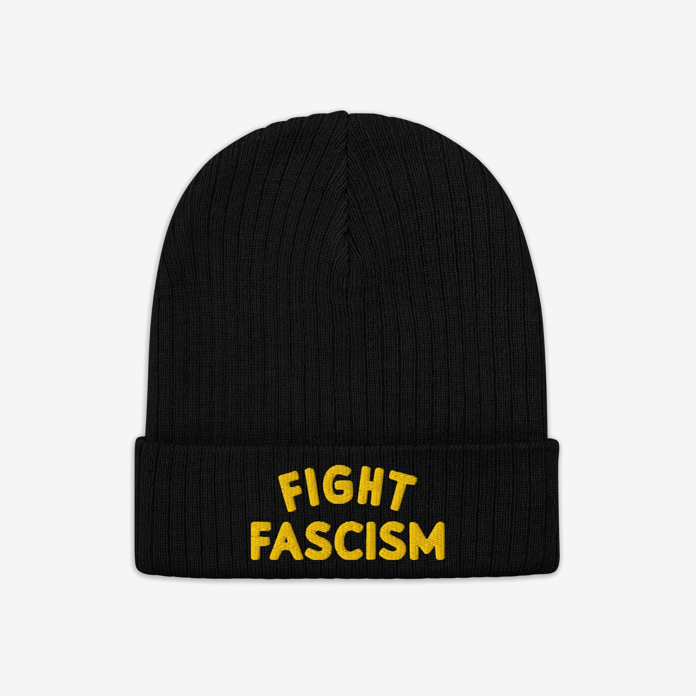 The Fight Fascism Hat features a black knit beanie with FIGHT FASCISM boldly embroidered in yellow on the cuff, making a clear anti-fascist statement for those committed to activism.