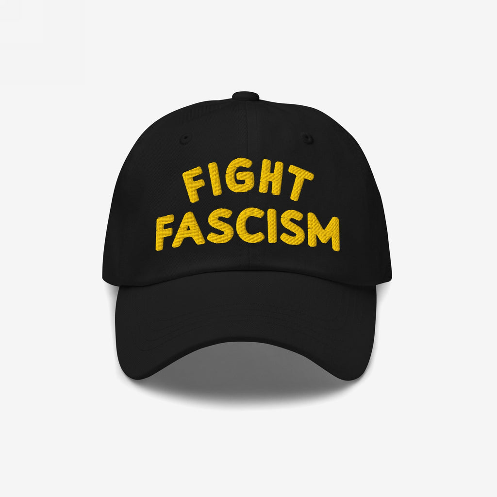 Fight Fascism Hat featuring bold yellow embroidery on a black baseball cap, symbolizing protest and visibility against hate, ideal for marches or daily wear.