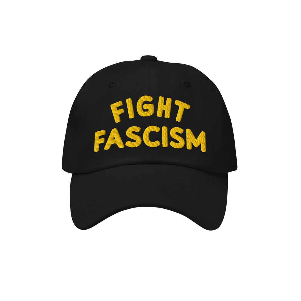 Fight Fascism Hat featuring bold yellow embroidery on a black baseball cap, symbolizing protest and visibility against hate, 