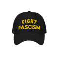 Fight Fascism Hat featuring bold yellow embroidery on a black baseball cap, symbolizing protest and visibility against hate, 