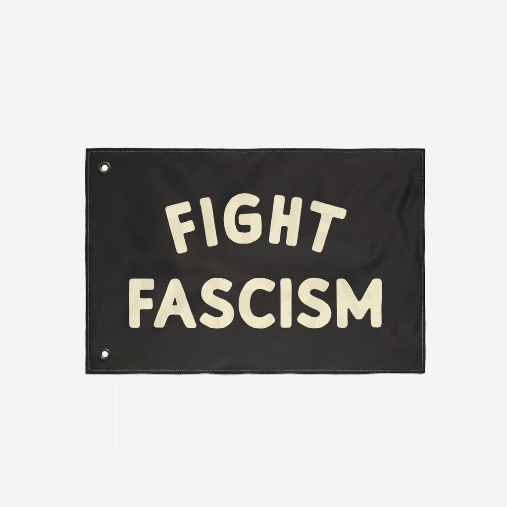 The Fight Fascism Flag features bold cream lettering on a black background, with metal grommets for hanging. Ideal for anti-fascist protests, it embodies a strong stance for equality and justice.