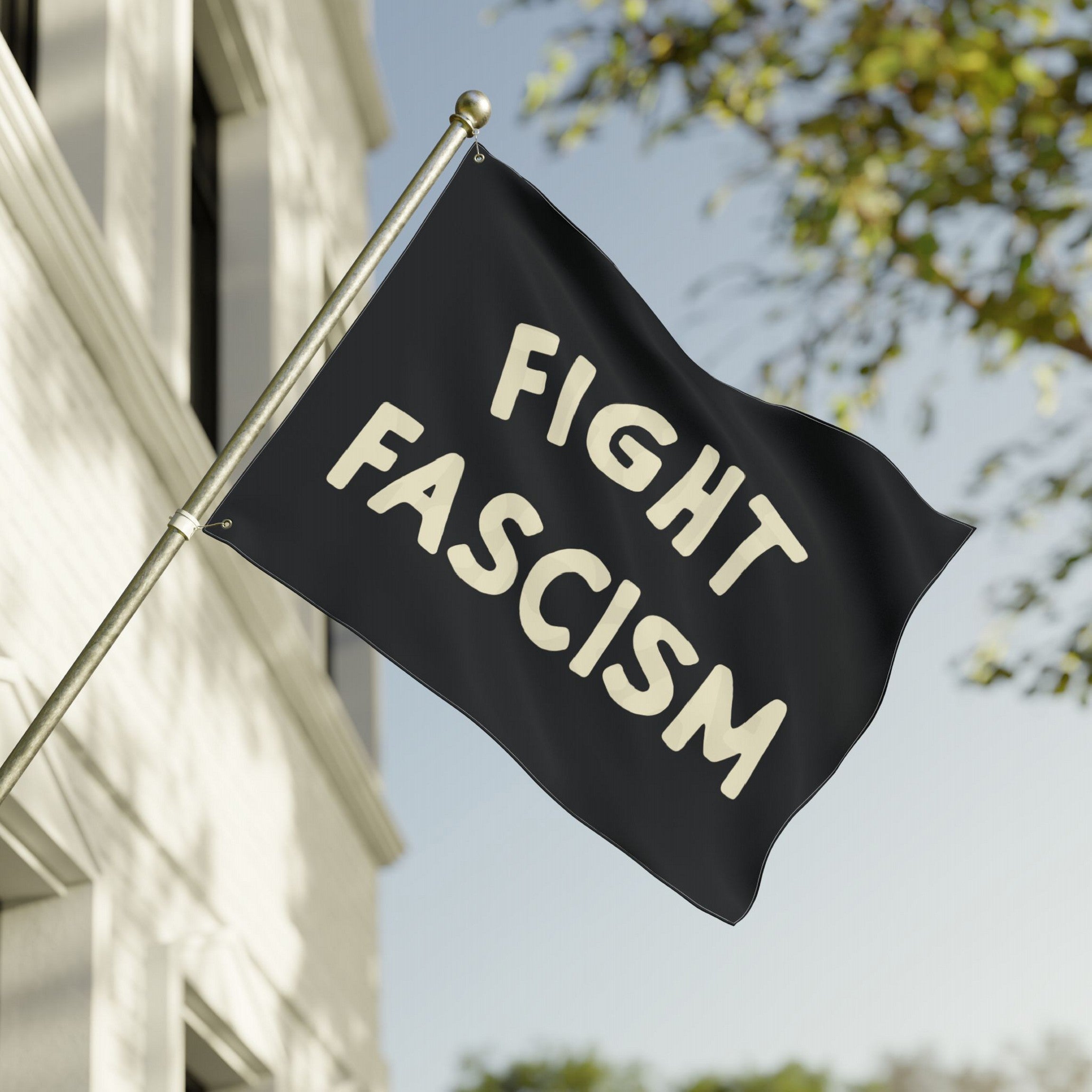 Fight Fascism Flag displayed outside, featuring bold cream text on a black background. Designed for equality advocates and anti-fascist protests, perfect for public demonstrations or personal expression.
