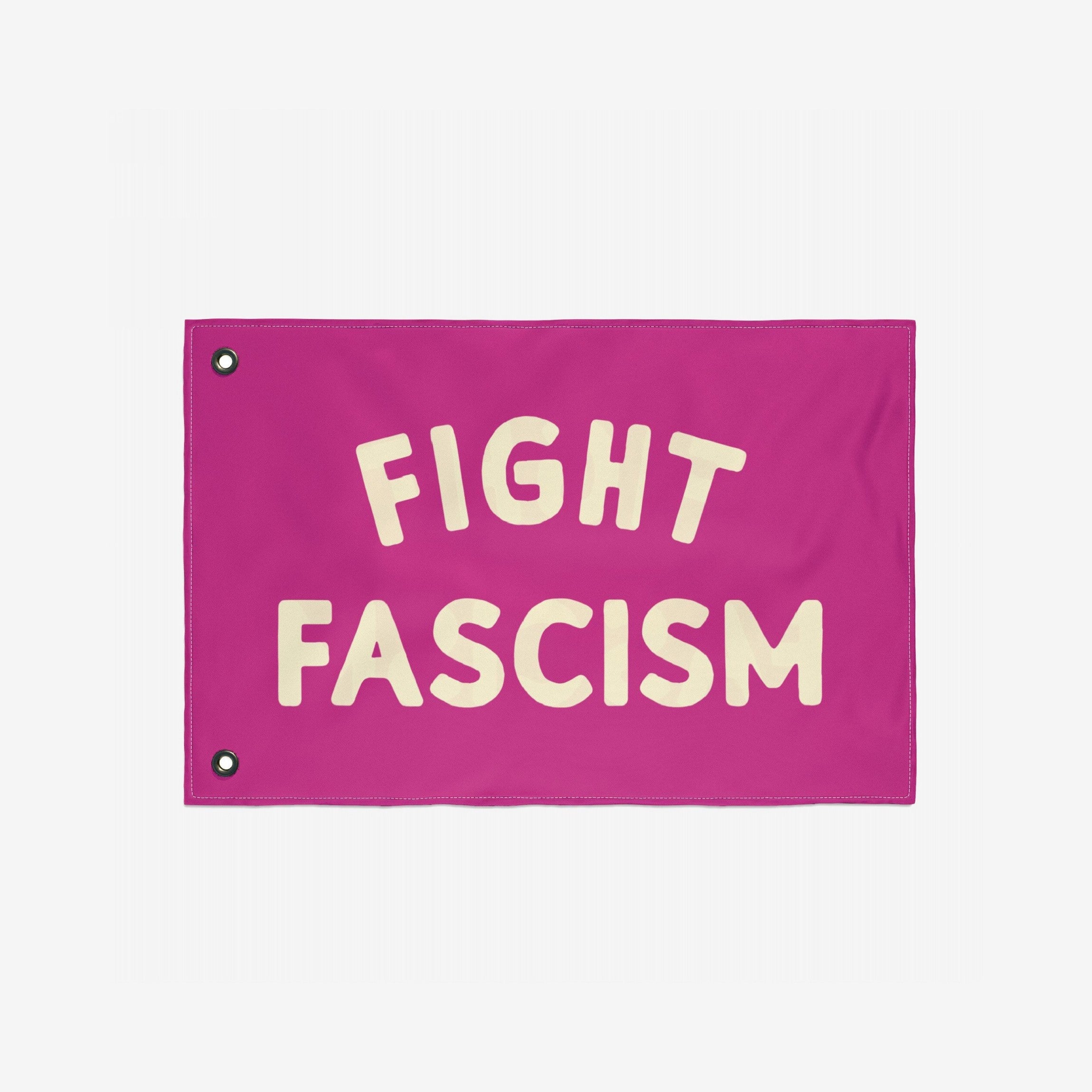 Fight Fascism Flag featuring bold, off-white text on a hot-pink background with metal grommets for hanging. This protest flag stands out, embodying a powerful anti-fascist message for equality and justice.